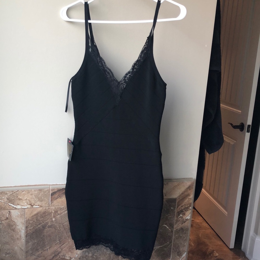 NWT Bebe black bandage dress with lace trim. Size S.